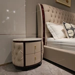 Round Cream Tufted Leather Nightstand with White Marble Top and Dark Glossy Frame